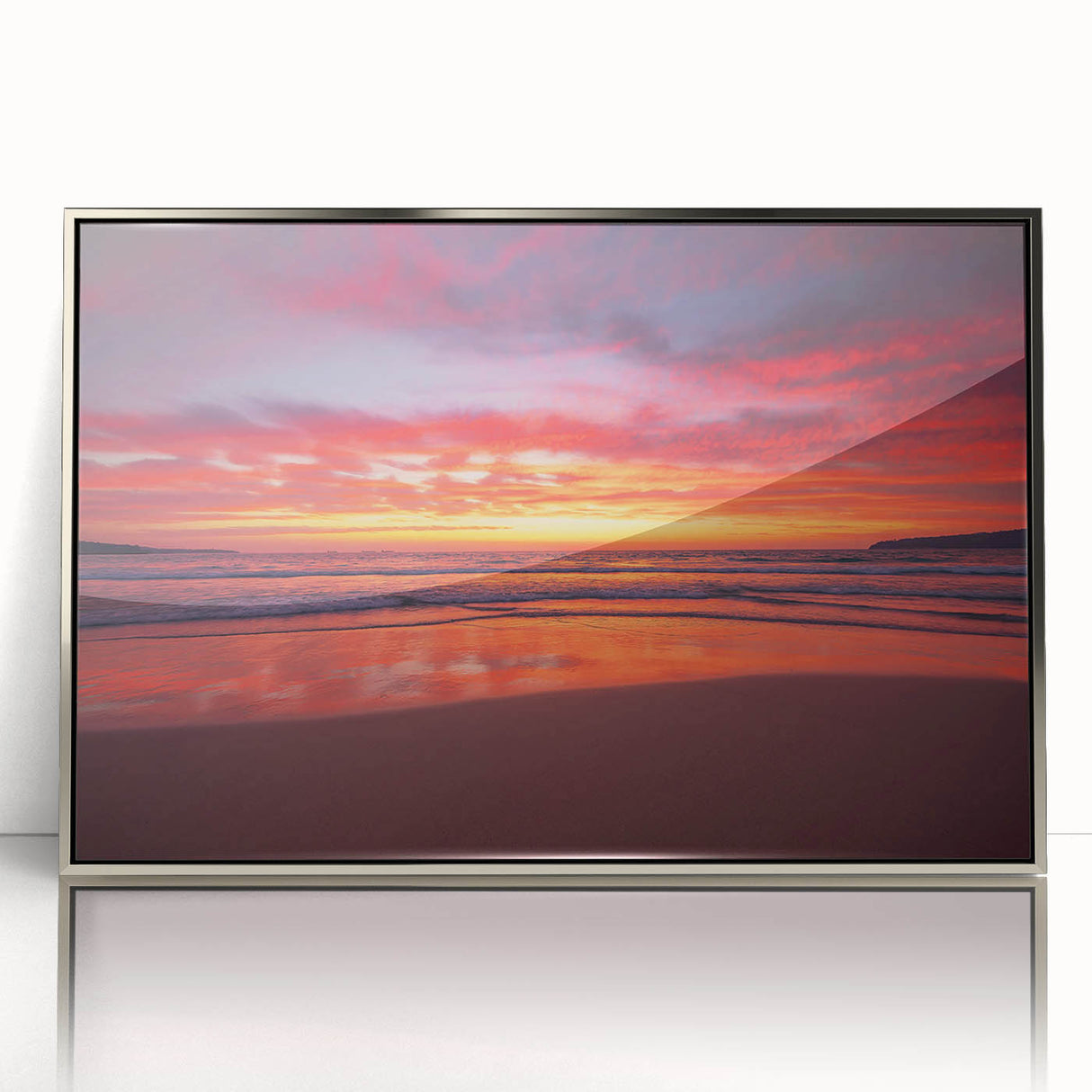 Art deco poster featuring a Caribbean scenery on silver-framed acrylic, with vibrant ocean and sky hues.