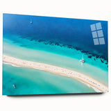 Large abstract wall art depicting a serene Caribbean scenery in muted blue and green tones, printed on acrylic glass.