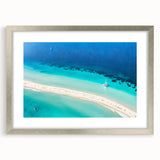 Extra large abstract art print featuring textured Caribbean scenery in vibrant blues and greens on a framed canvas.