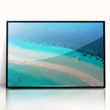 Large abstract wall art depicting a Caribbean seascape in vibrant blue and green tones on a framed acrylic print.