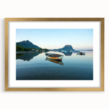 Abstract art print of Caribbean scenery in muted blue and green, framed in gold, suitable for dining room decor.