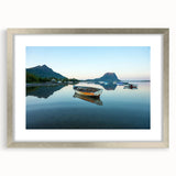 Extra large wall art depicting an abstract Caribbean scenery in textured blues and greens, framed in silver.