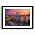 Abstract art print featuring vibrant, textured colors, framed in black, ideal for living room decor.