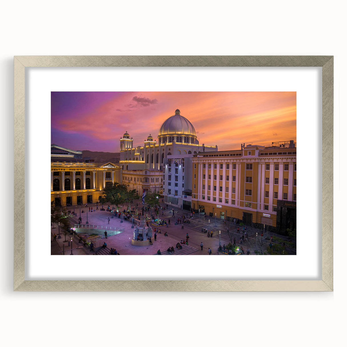 Textured abstract art print depicting a Central American landscape in muted earth tones, framed in silver.
