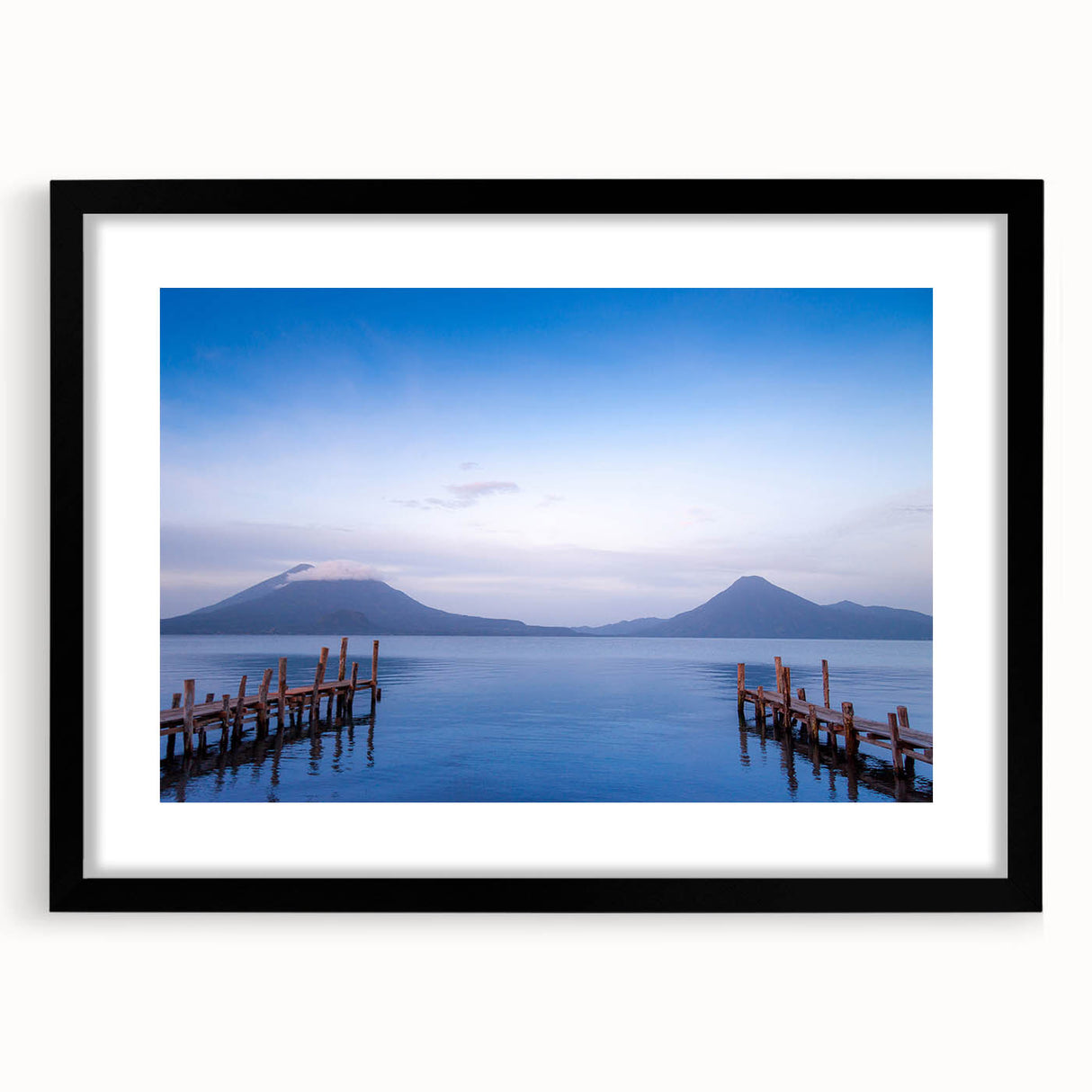 Abstract art print depicting vibrant, colorful Central American scenery on a large textured canvas, framed in black.