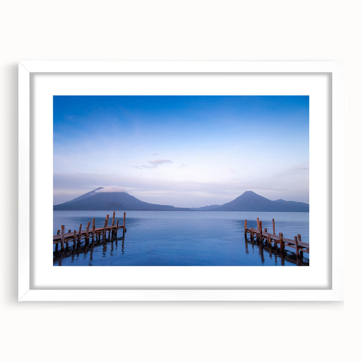 Abstract art print of a Central American landscape in muted earth tones on a framed white mat, ideal for dining room decor.