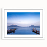 Abstract art print of a Central American landscape in muted earth tones on a framed white mat, ideal for dining room decor.