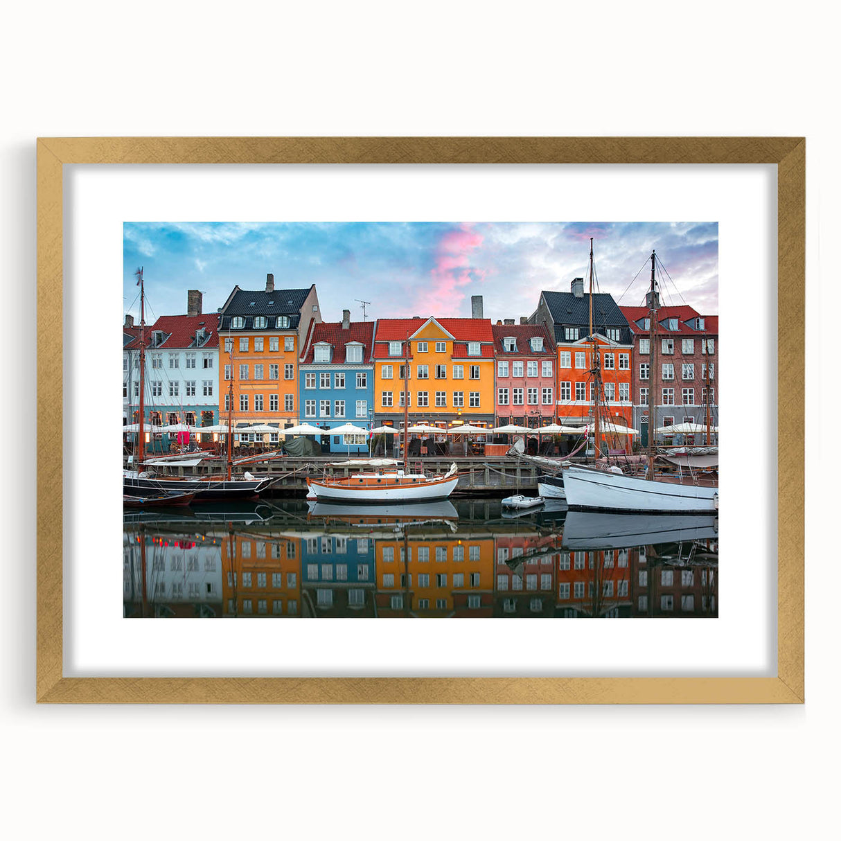 Abstract art print of a European scenery in muted earth tones, framed in gold, suitable for bedroom or dining room decor.