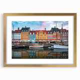 Abstract art print of a European scenery in muted earth tones, framed in gold, suitable for bedroom or dining room decor.