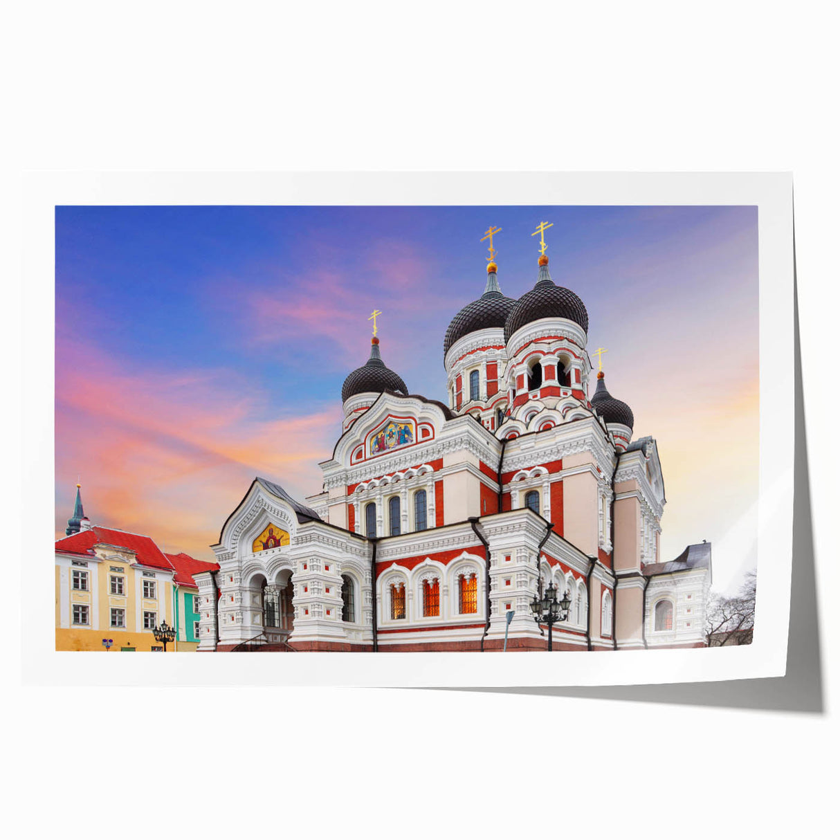 Rolled print of a European scenery with floral accents in pastel shades.