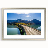 Extra large abstract art print of a Bavarian landscape in muted earth tones, framed in silver.