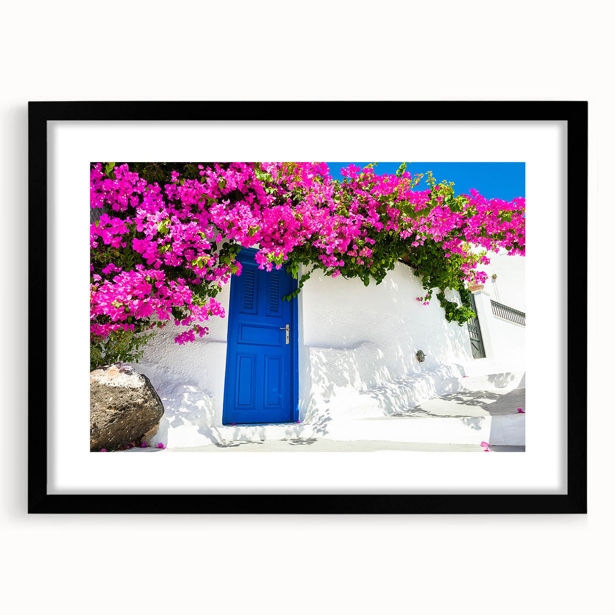 Colorful abstract art print of Santorini with textured details on a large black-framed canvas, ideal for living room decor.