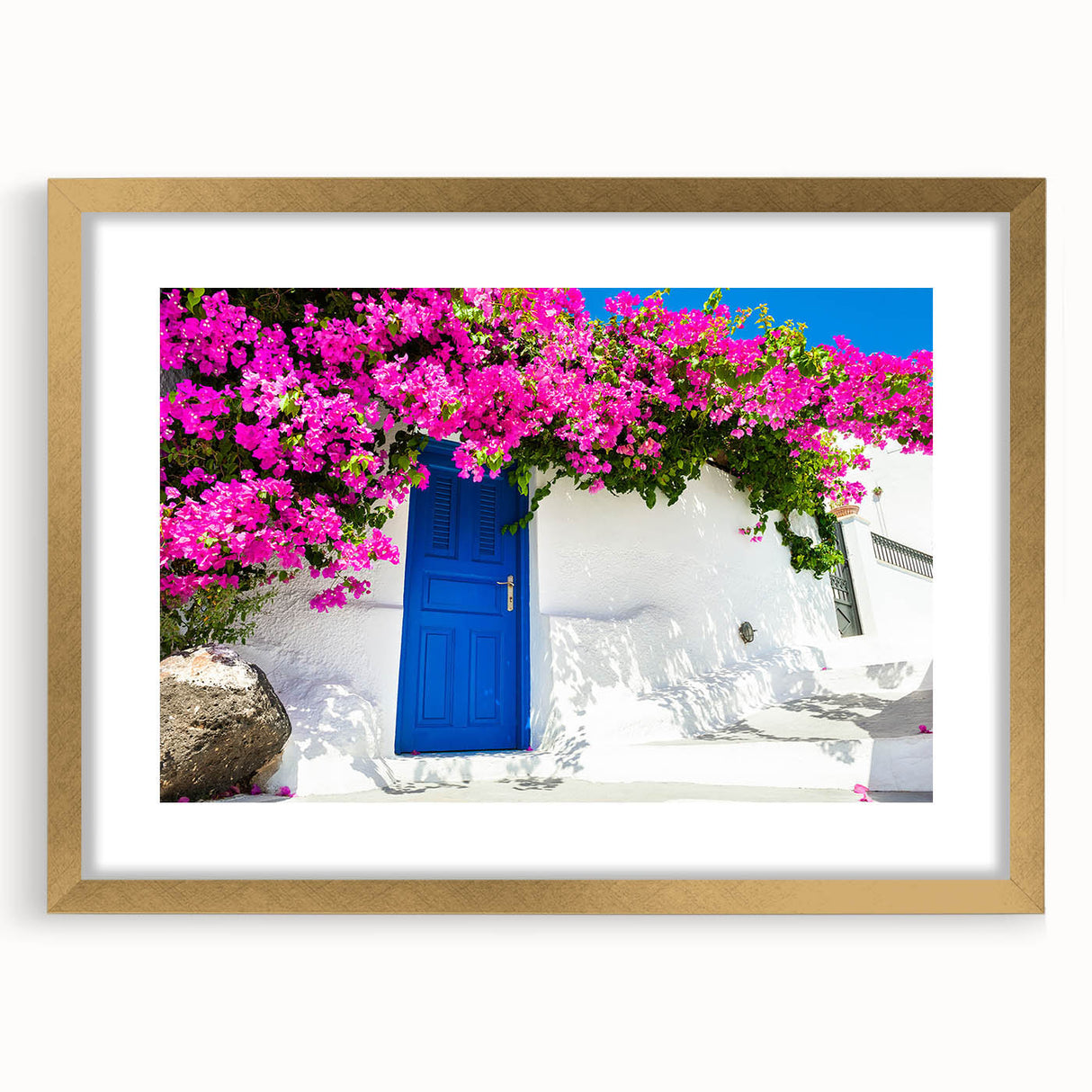 Abstract art print of Santorini with blue and white tones on a gold-framed canvas, ideal for dining room decor.