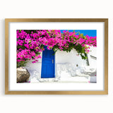 Abstract art print of Santorini with blue and white tones on a gold-framed canvas, ideal for dining room decor.