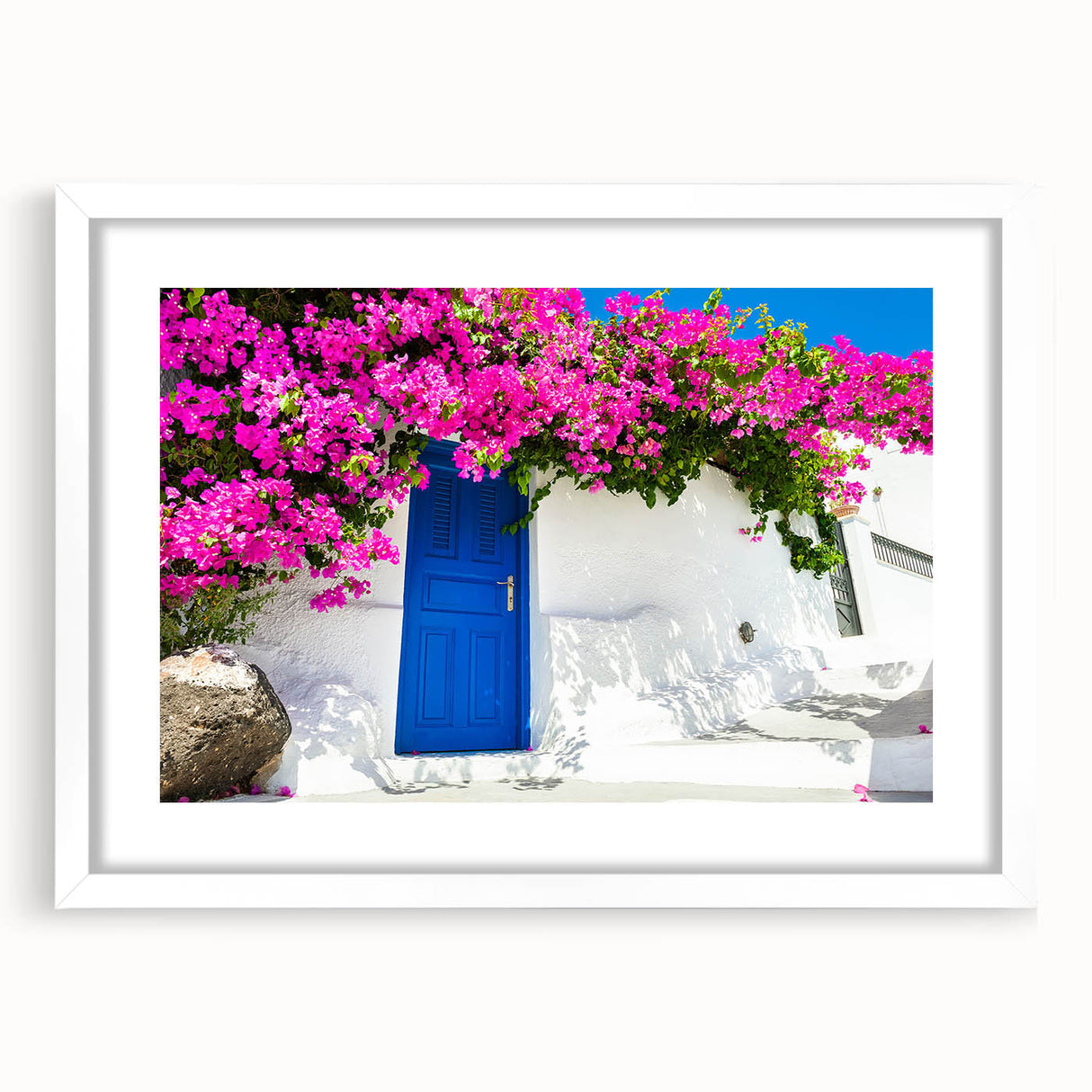 Textured art print of Santorini with abstract white buildings and blue domes on a framed white mat, ideal for bedroom art.