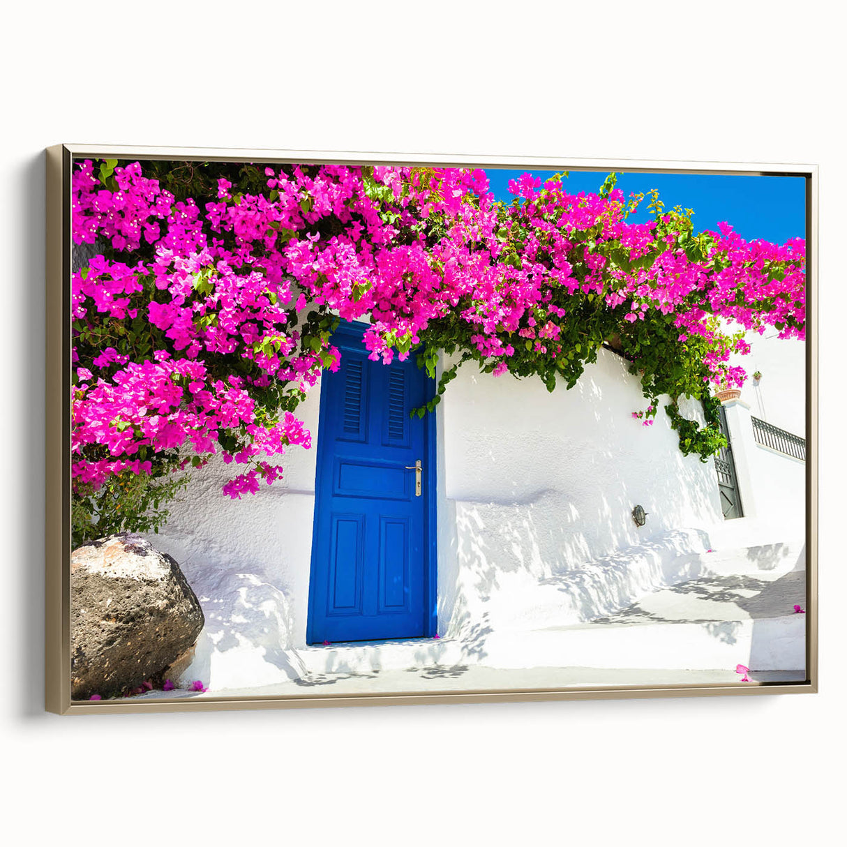Framed canvas of Santorini landscape with muted blues and whites, ideal for bedroom wall art.
