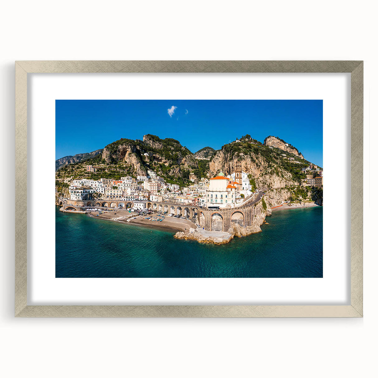Extra large wall art featuring an abstract rendition of the Amalfi Coast in textured hues of blue and white.