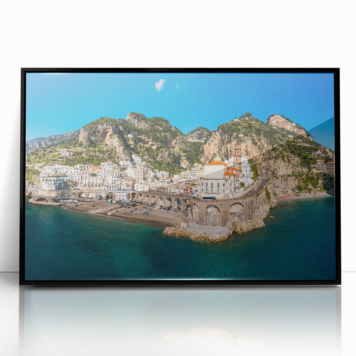 Framed acrylic print of Amalfi Coast with vivid blue and white colors in a mid-century modernist style.