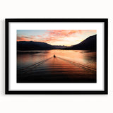 Abstract art print of Lake Como with vibrant colors and textured surface, framed in black, ideal for living room decor.