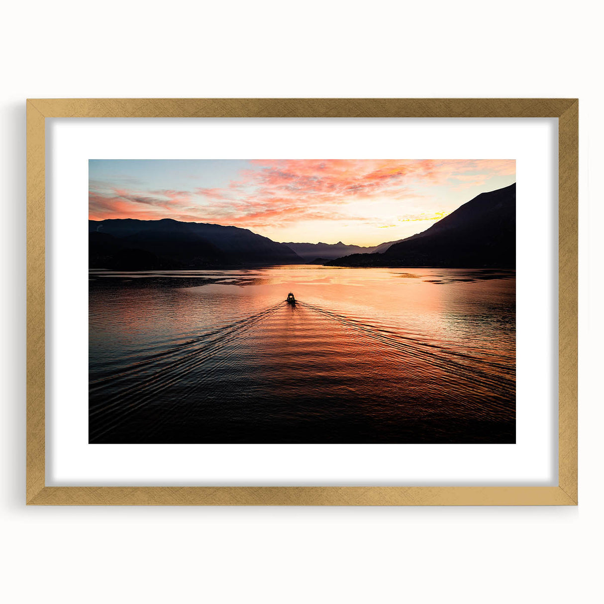 Abstract art print of Lake Como with muted blue and green tones, framed in gold, ideal for dining room decor.