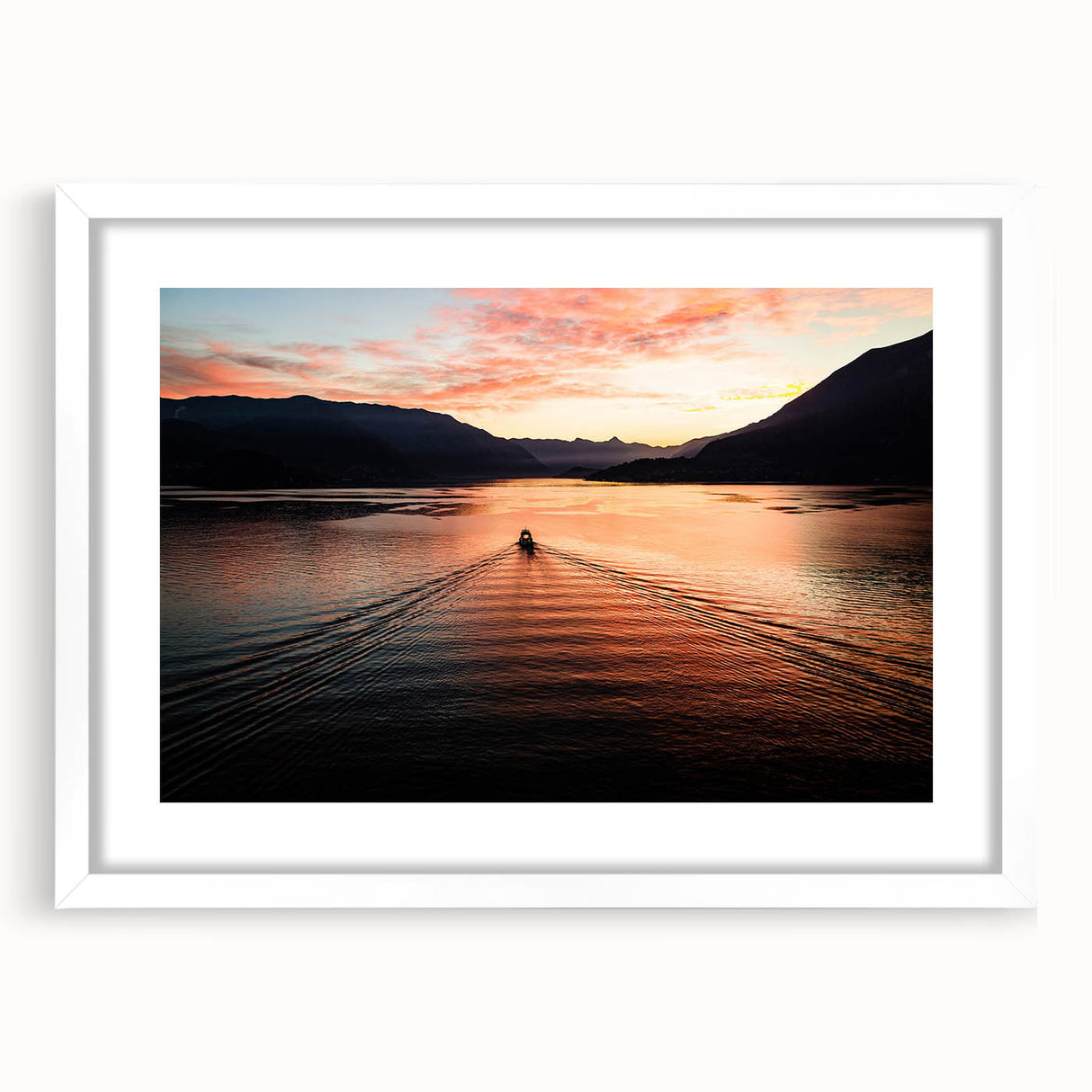 Textured art of Lake Como with abstract blue and green hues on a framed white mat, suitable for bedroom decor.