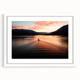 Textured art of Lake Como with abstract blue and green hues on a framed white mat, suitable for bedroom decor.