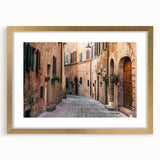 Abstract art print of the Tuscan landscape in earthy tones on a framed canvas, suitable for dining room decor.