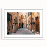 Textured art depicting a serene Tuscan landscape in soft earth tones on a framed white matte canvas.