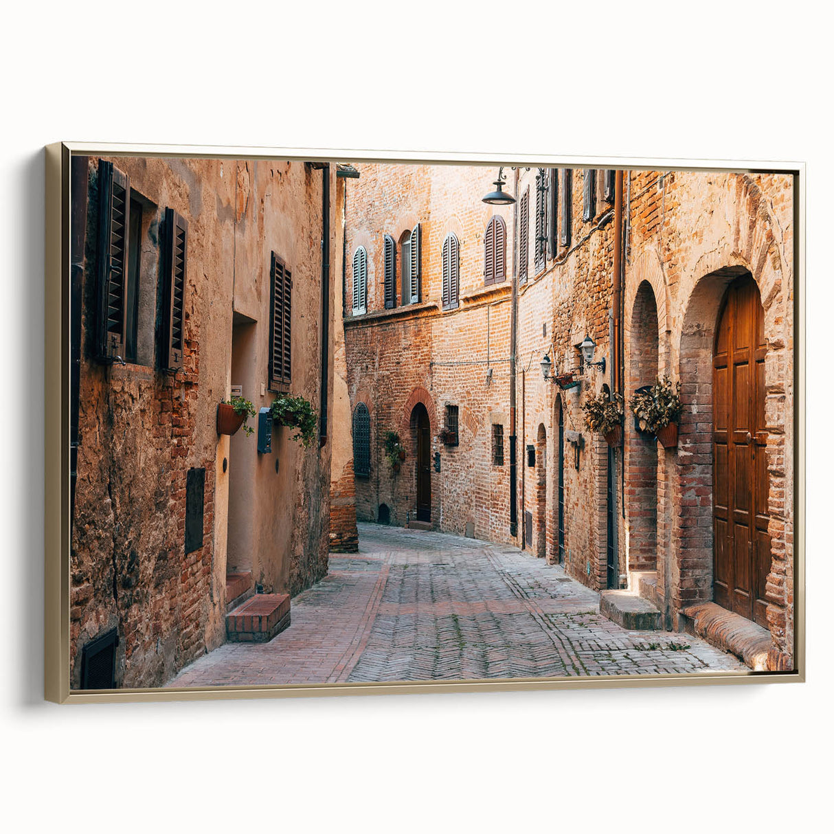 Framed canvas of a Tuscan landscape painting in muted earth tones, ideal for bedroom wall art.