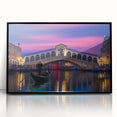 Large abstract wall art depicting a Venetian scenery in muted earth tones on a black framed acrylic.