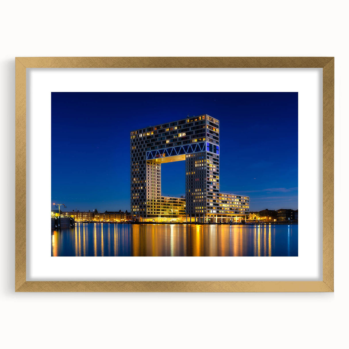 Abstract art print of Amsterdam canal scene in muted blues and greys, framed in gold, ideal for dining room decor.