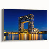 Framed canvas featuring a vintage-style landscape painting of Amsterdam with colorful buildings and black sky.