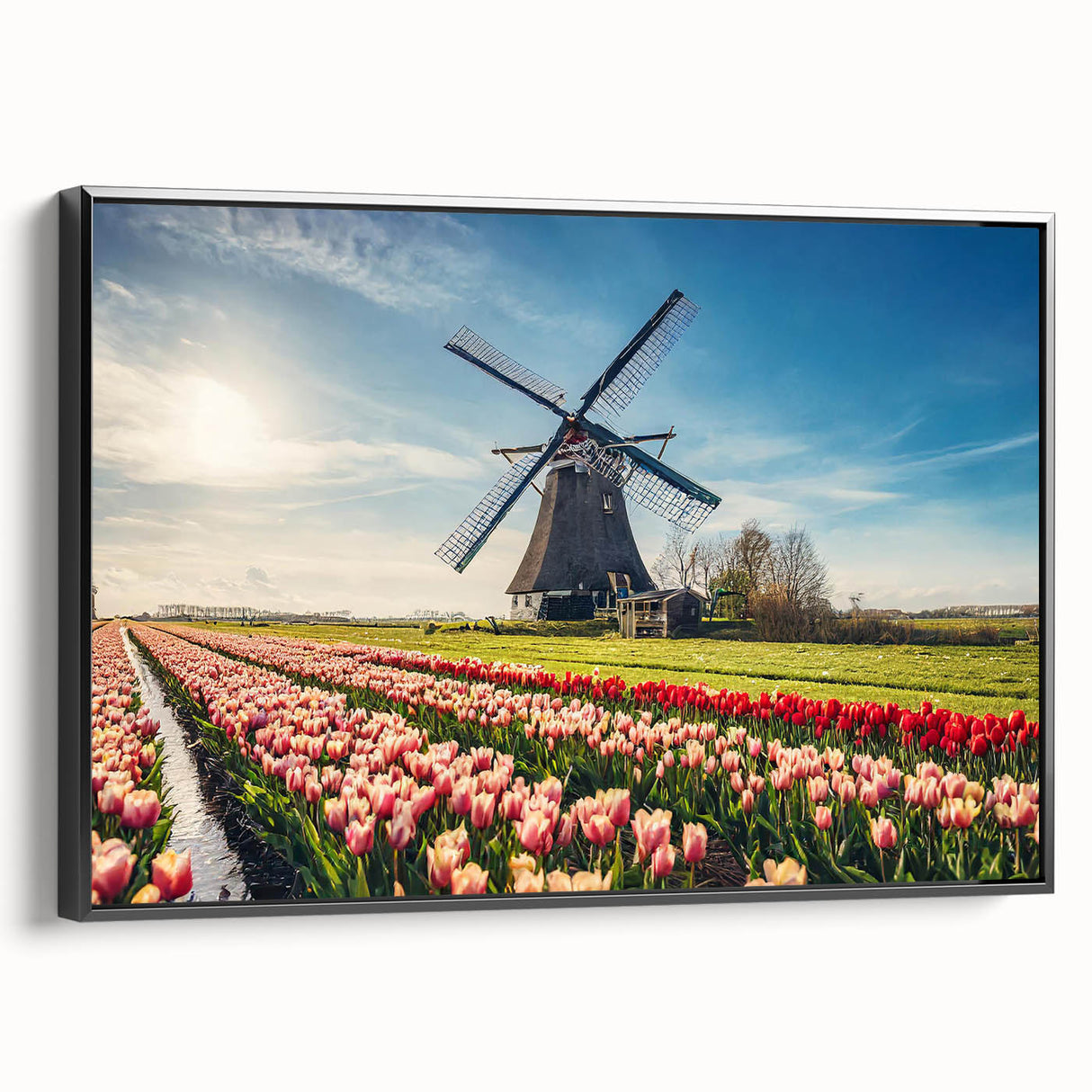 Black and white wall art featuring a vintage poster art style landscape of the Netherlands on a framed canvas.