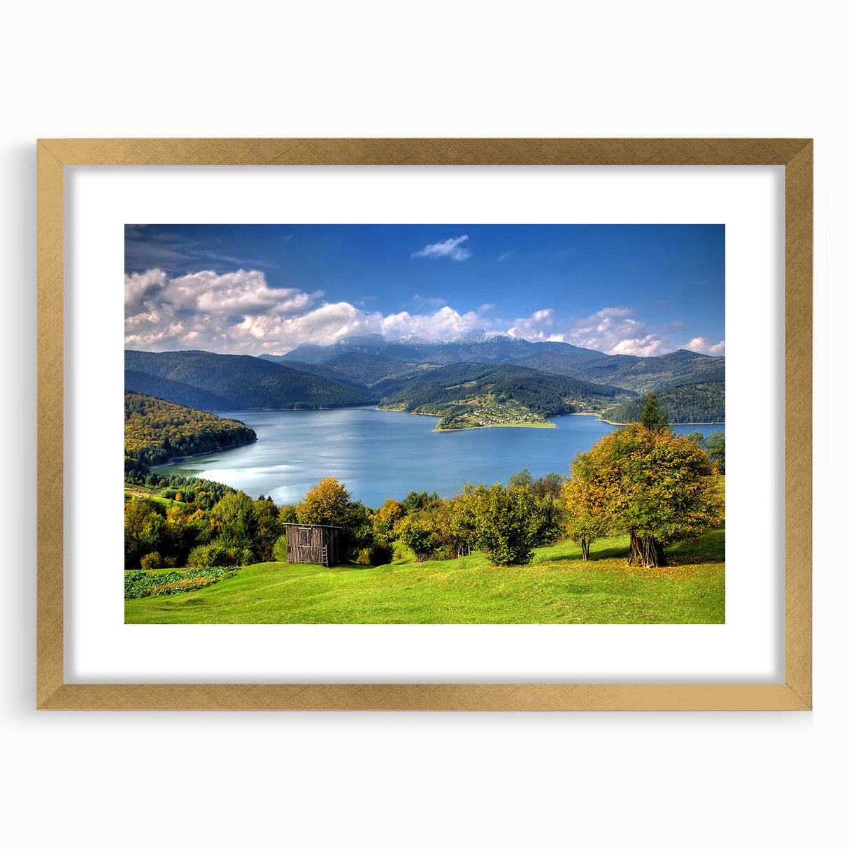 Abstract art print of a European Romanian scenery in muted earth tones on a framed gold canvas.