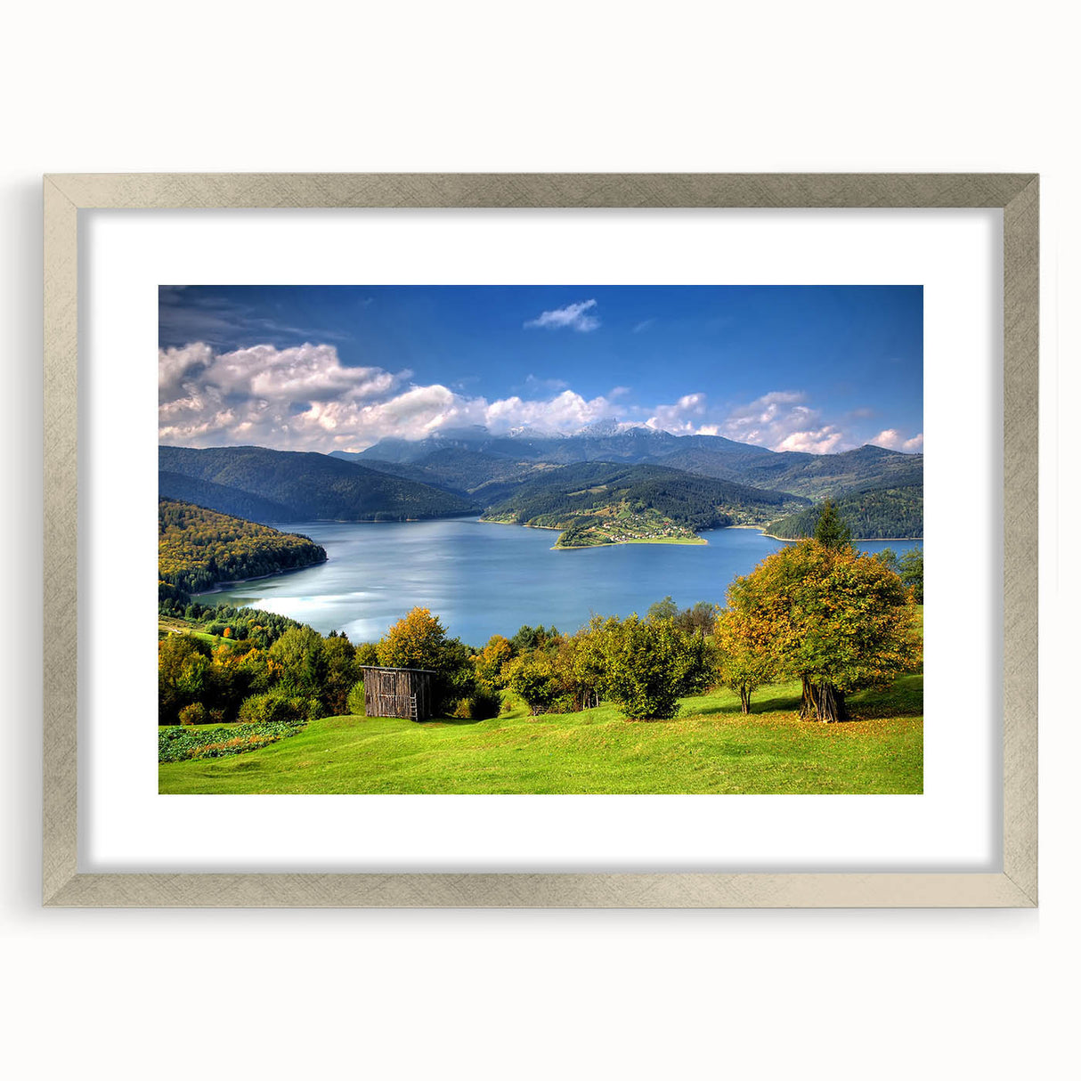 Extra large abstract art print depicting a textured European landscape in muted earth tones, framed in silver.