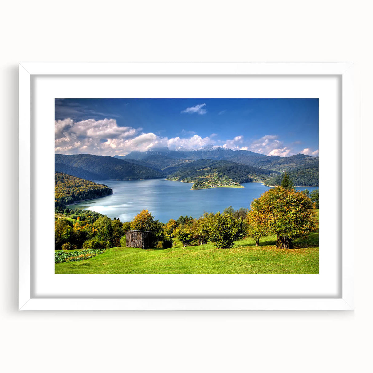 Textured abstract art print depicting a European scenery in muted earth tones, framed with a white mat.