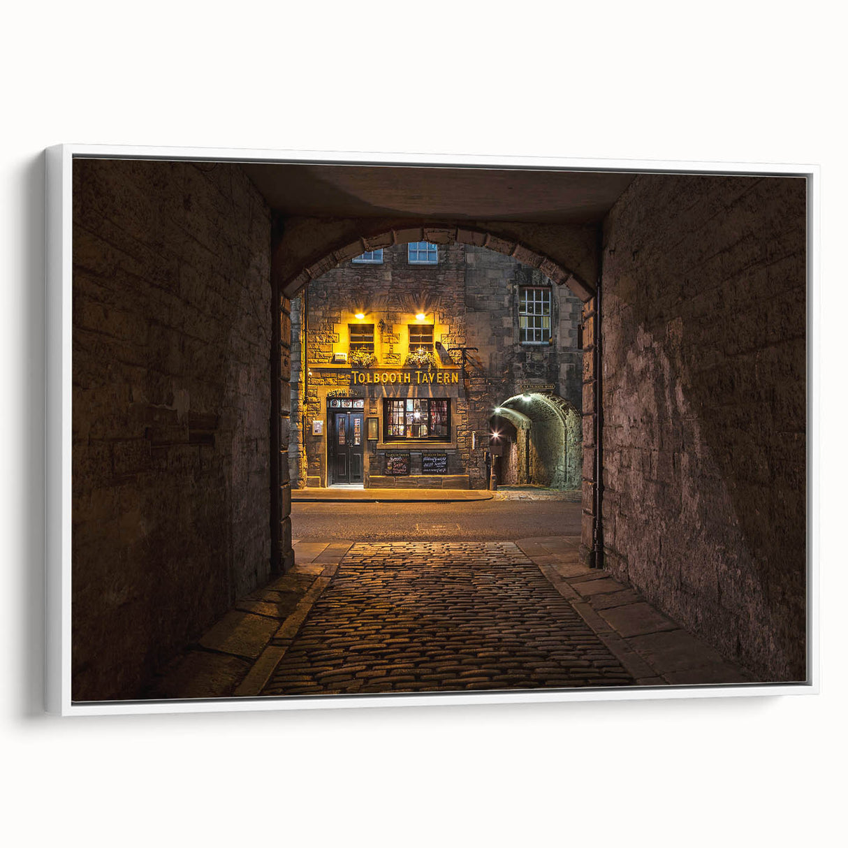 Framed vintage poster art of a Scottish landscape on canvas, featuring muted earth tones, ideal for living room decor.