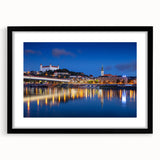 Extra large abstract art print of a colorful European scenery on textured canvas, framed in black.