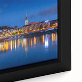 Close-up of a black framed canvas featuring a textured, colorful European scenery, ideal for living room decor.