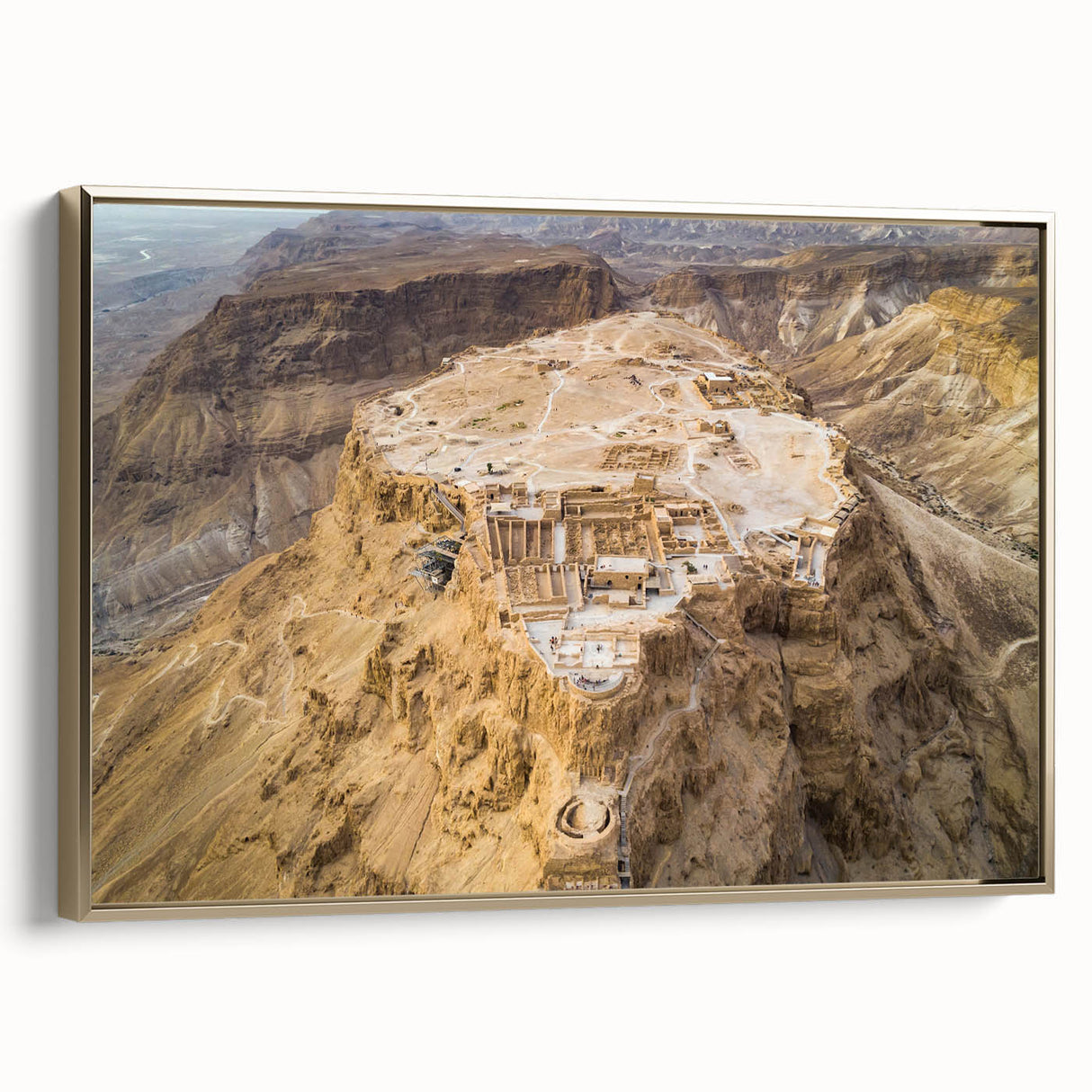 Vintage poster art of a Middle Eastern landscape on framed canvas, featuring black and gold tones.