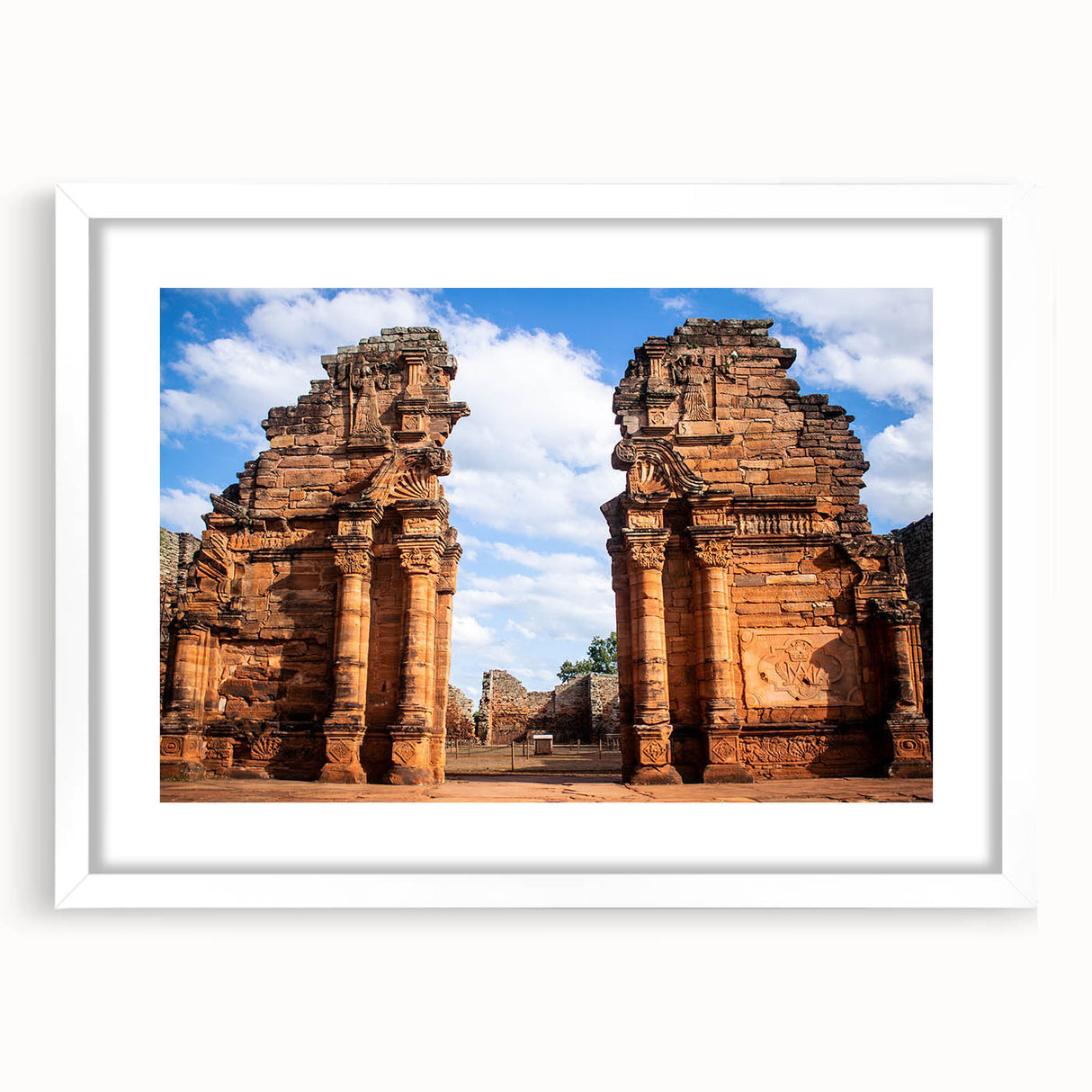 Abstract art print of Jordanian landscape in muted earth tones on a framed white mat, ideal for dining room decor.