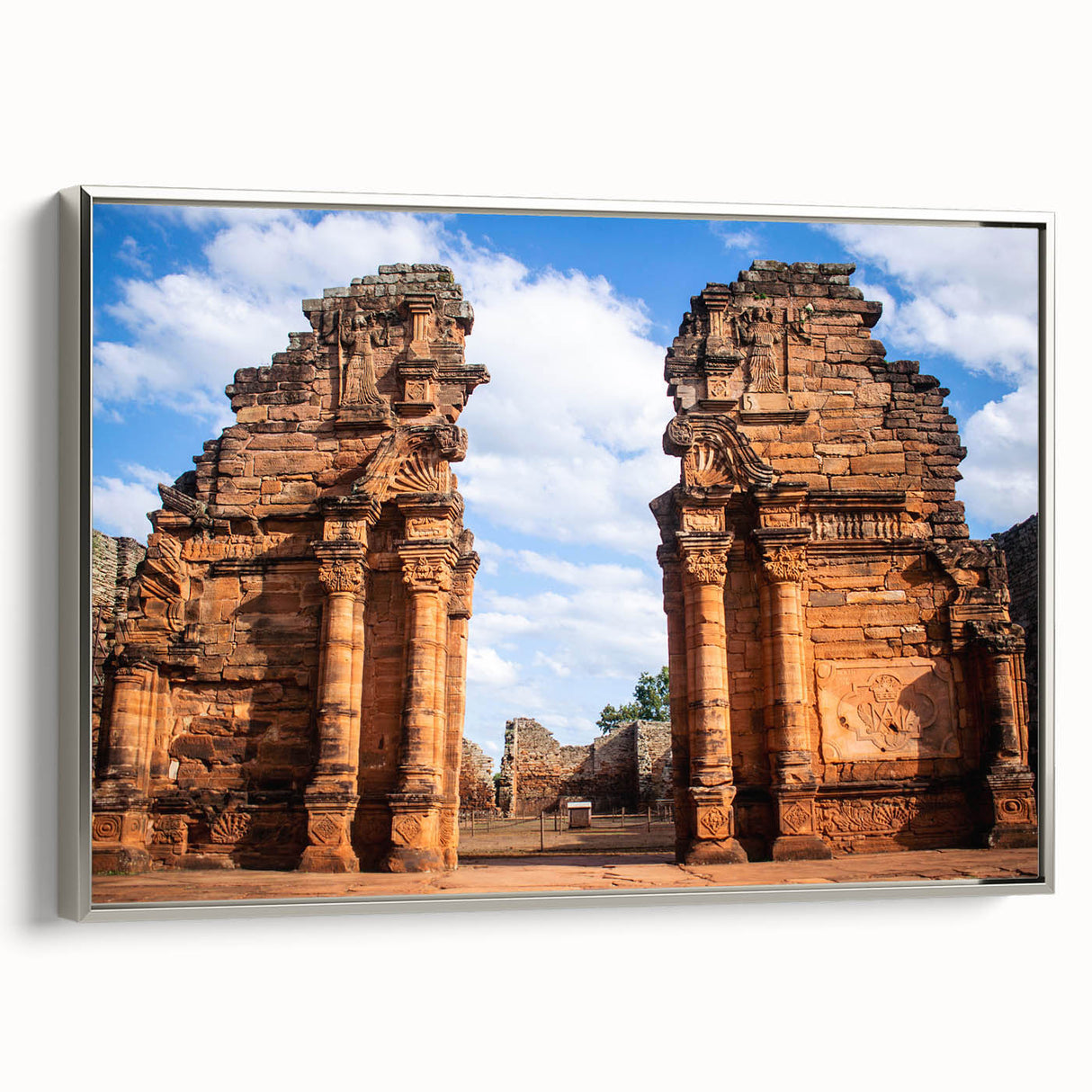 Framed canvas featuring a vintage-style landscape painting of a Middle Eastern scene in muted earth tones.