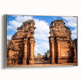 Framed canvas featuring a vintage-style landscape painting of a Middle Eastern scene in muted earth tones.