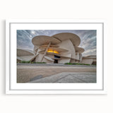 Abstract art print of Qatar scenery in muted earth tones on a white matted frame, suitable for dining room decor.