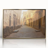 Large art print of a mid-century modernist Saudi Arabian scenery in gold tones on framed acrylic.