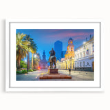 Abstract art print of Santiago skyline in muted earth tones on a framed white mat, suitable for dining room decor.
