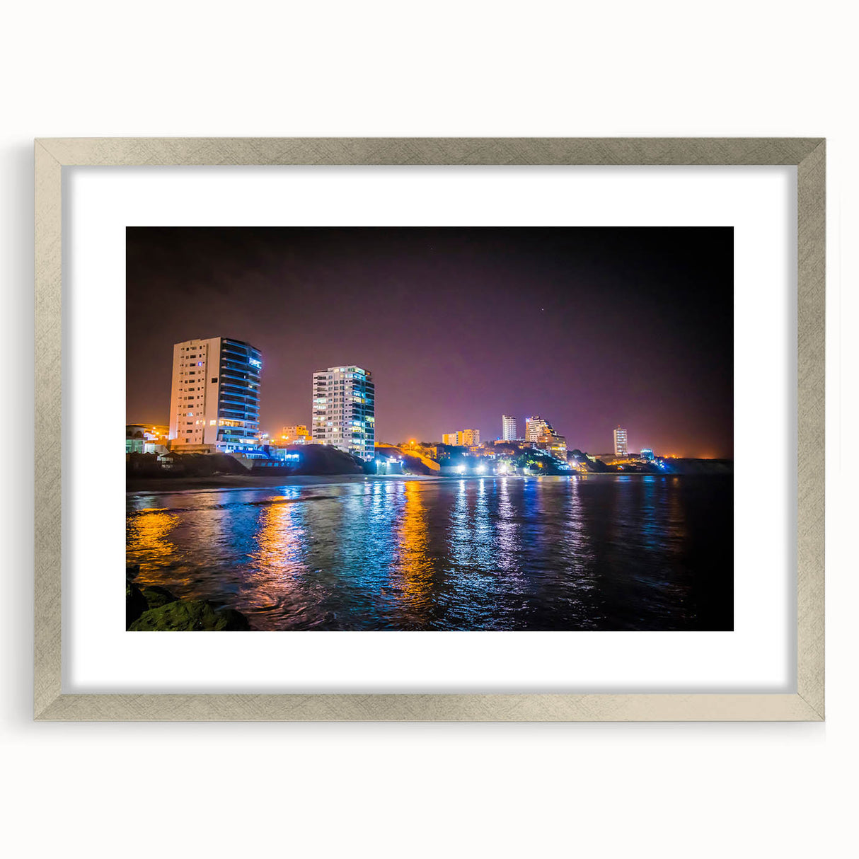 Textured art depicting an abstract South American landscape in earthy tones, framed with a silver mat.