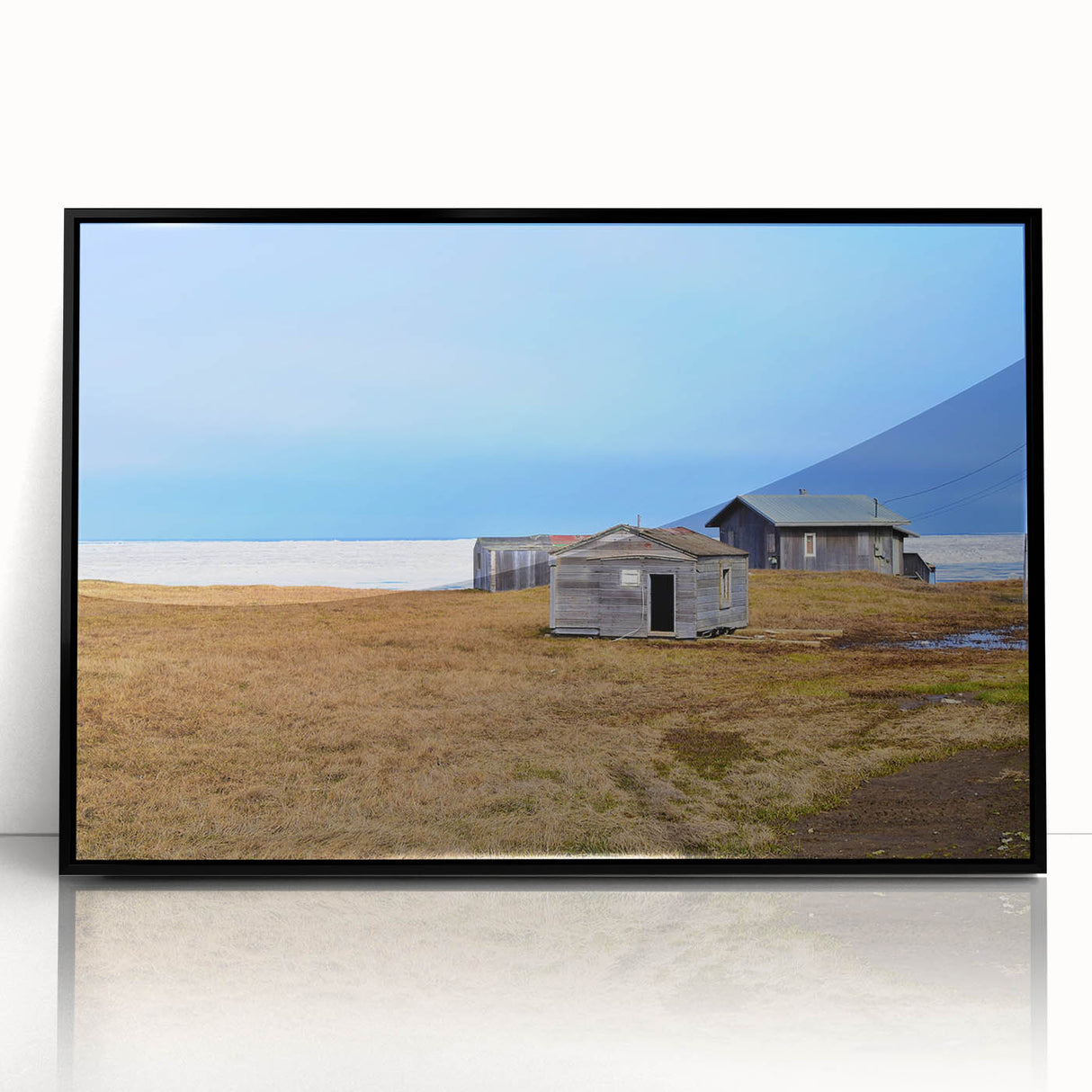 Large abstract wall art featuring Alaska scenery in muted gray and blue tones on a framed acrylic print.