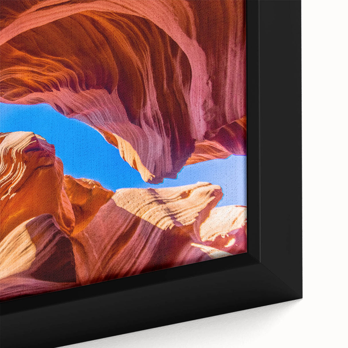 Close-up of a textured, extra large framed canvas featuring a black and colorful Antelope Canyon scene.