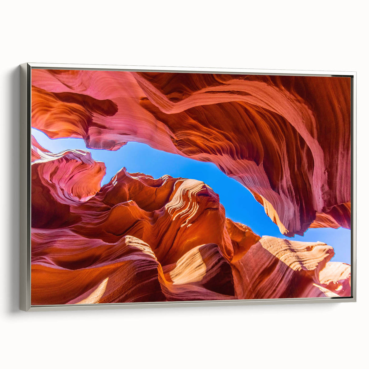 Antelope Canyon landscape art on silver-framed canvas, highlighting orange and black tones, ideal for office decor.